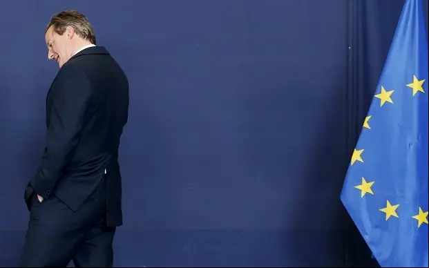 Britain's Prime Minister David Cameron arrives to pose for a family photo during a European Union leaders summit in Brussels April 23, 2015. European Union leaders who decided last year to halt the rescue of migrants trying to cross the Mediterranean will reverse their decision on Thursday at a summit hastily convened after nearly 2,000 people died at sea. REUTERS/Francois Lenoir