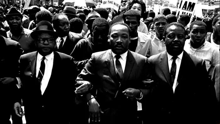 The Rev. Ralph Abernathy, right, and Bishop Julian Smith, left, flank Dr. Martin Luther King, Jr., during a civil rights march in Memphis, Tenn., March 28, 1968. (AP Photo/Jack Thornell)